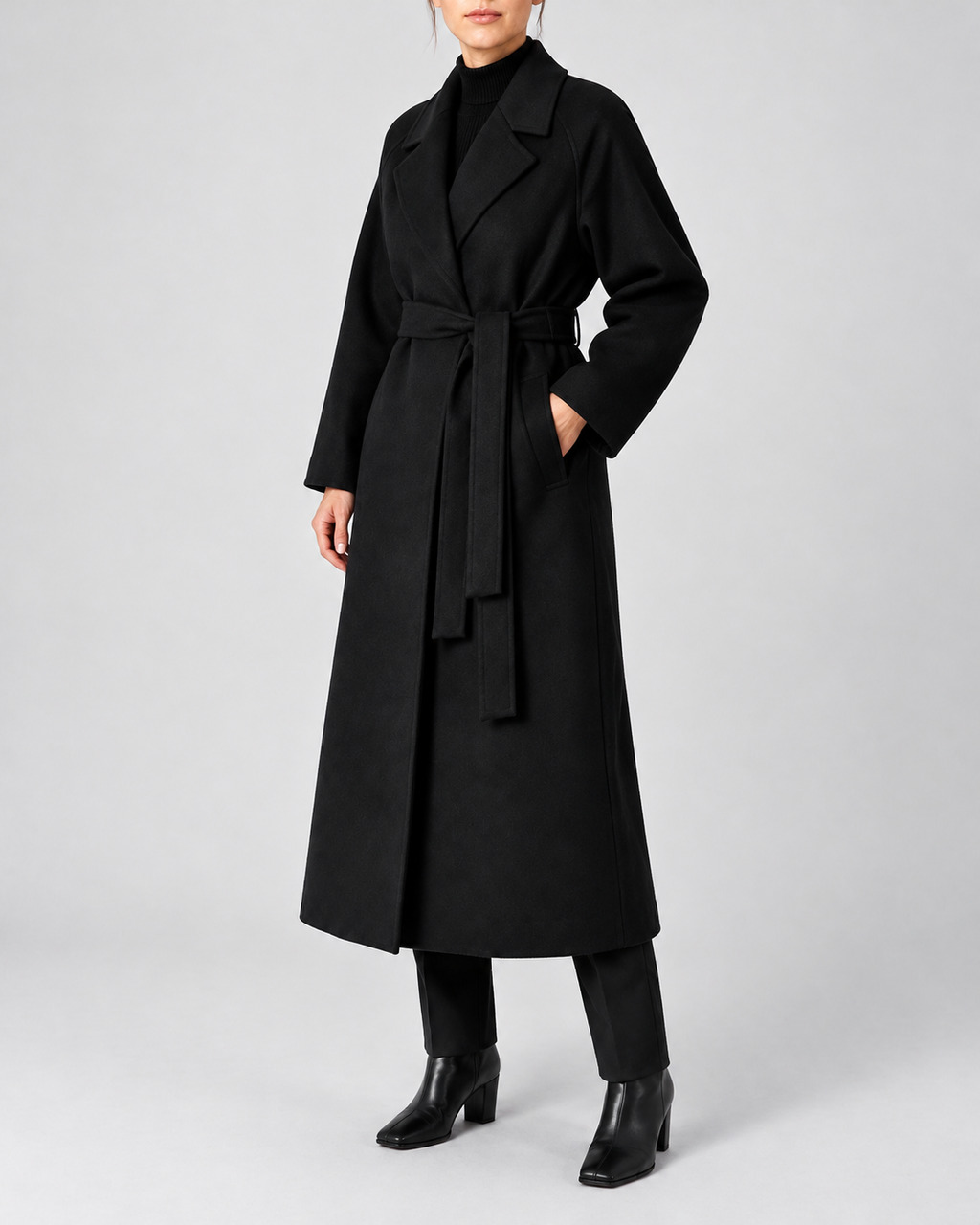 Women's Long Belted Coat with Raglan Sleeves and Side Pockets in Black – Three-Quarter View