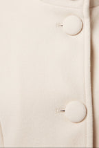 Women's Longline Coat with Funnel Neck and Covered Button Front in White – Detail View