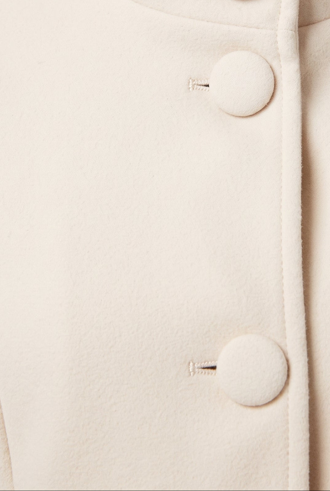 Women's Longline Coat with Funnel Neck and Covered Button Front in White – Detail View