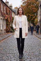 Women's Longline Coat with Funnel Neck and Covered Button Front in White – Lifestyle View