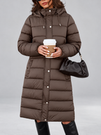 Women's longline hooded puffer coat in Brown – front