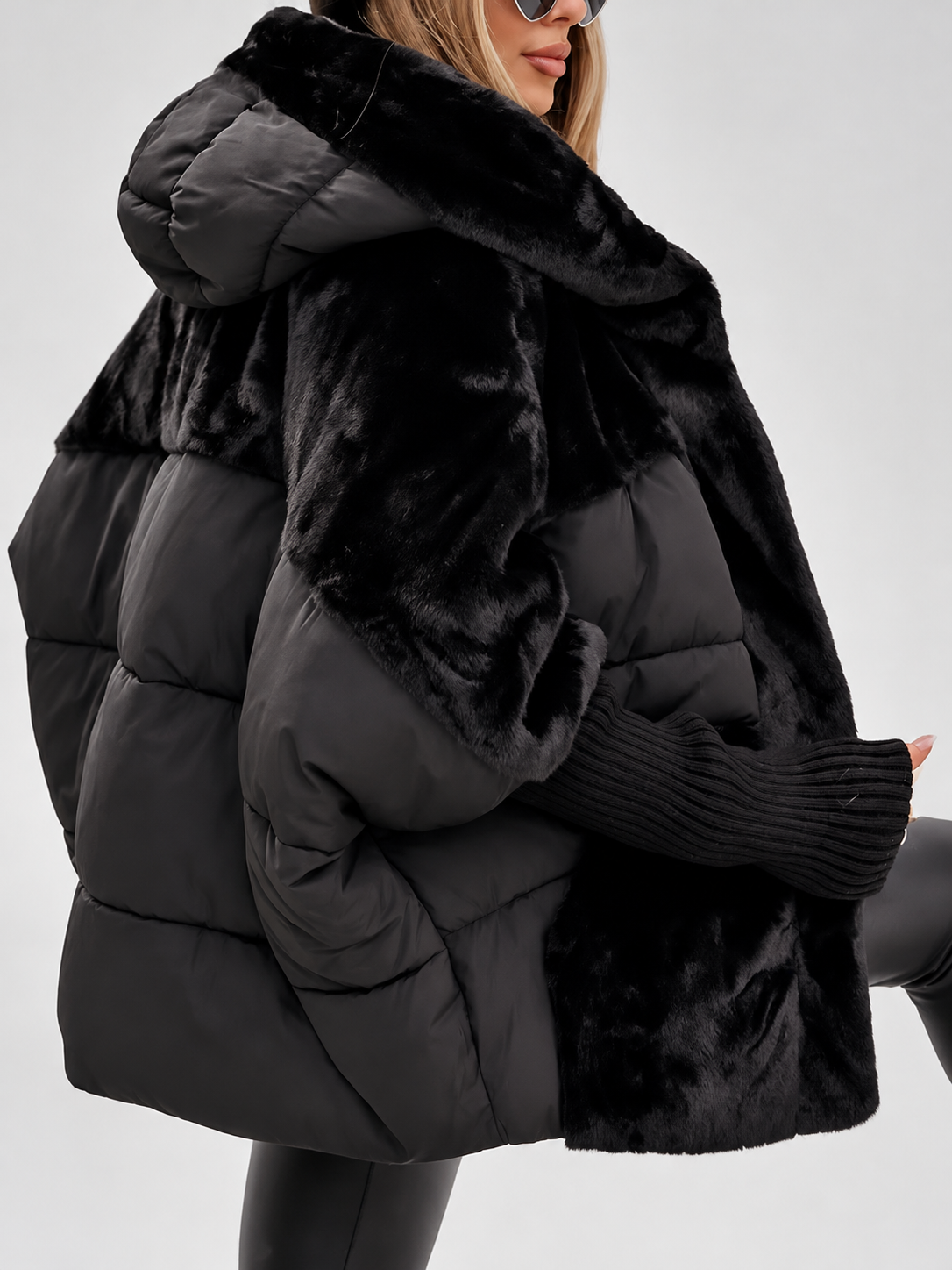 Women's Oversized Hooded Puffer Jacket with Plush Panels and Knit Sleeves in Black – Side View
