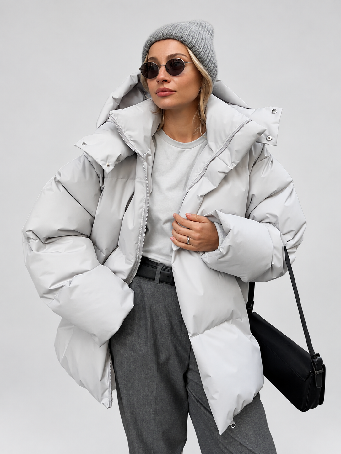 Women's Oversized Hooded Puffer Jacket with High Collar and Wide Quilting in Light Grey – Front View