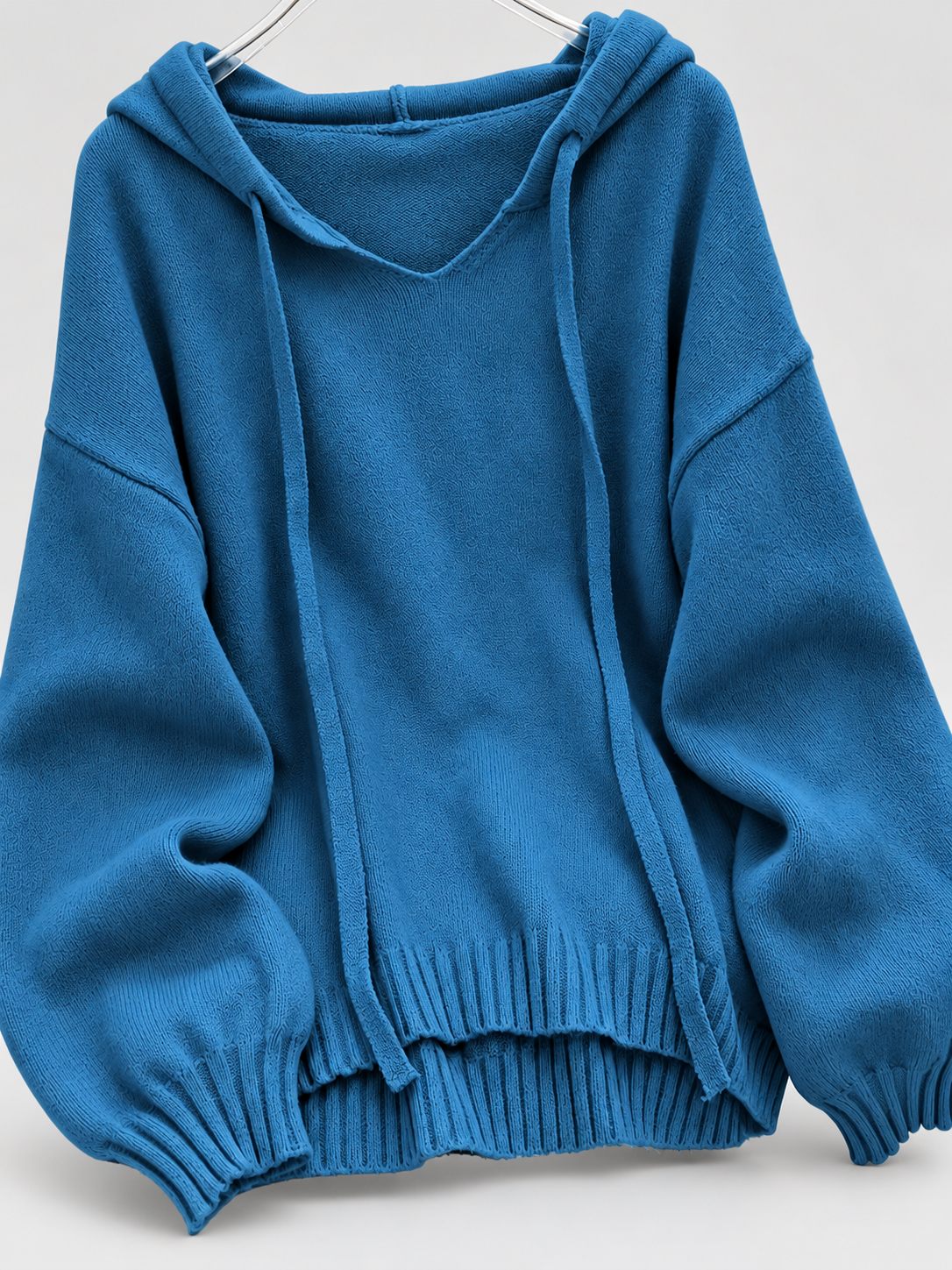 Women's Oversized Knitted Hooded Jumper with Drawstrings and Balloon Sleeves in Blue – Flat Lay