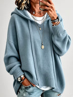 Women's Oversized Knitted Hooded Jumper with Drawstrings and Balloon Sleeves in Military Blue – Front View