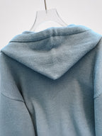 Women's Oversized Knitted Hooded Jumper with Drawstrings and Balloon Sleeves in Military Blue – Detail