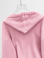 Women's Oversized Knitted Hooded Jumper with Drawstrings and Balloon Sleeves in Pink – Detail