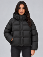 Black oversized hooded puffer jacket detail
