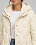 Women's Quilted Jacket with Ribbed Knit Hood and Snap Flap Pockets in Off White – Detail