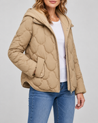 Women's Quilted Jacket with Ribbed Knit Hood and Snap Flap Pockets in Camel – Three-Quarter View
