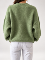 Green women's knitted crew neck jumper — studio view 2