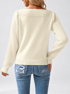 Women's round neck knitted jumper in Apricot, back view with open knit sleeves