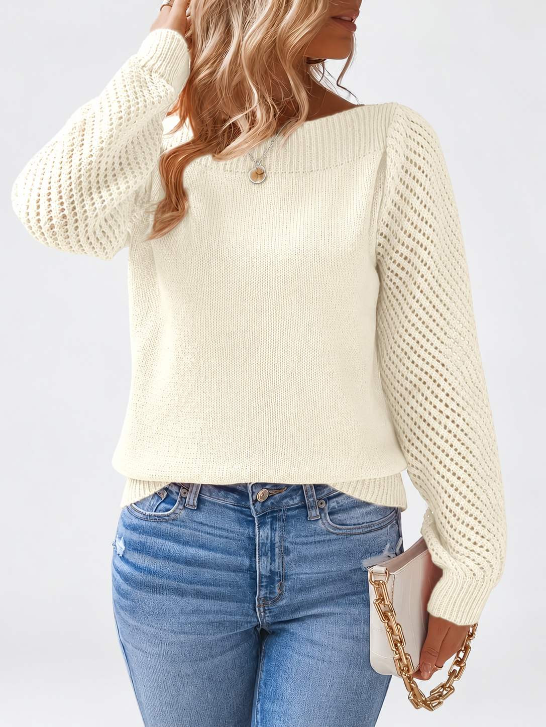 Women's round neck knitted jumper in Apricot, close view with open knit sleeves