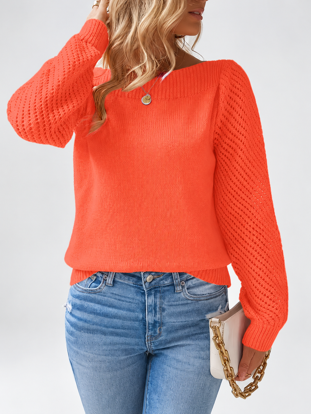Women's round neck knitted jumper in Orange, close view with open knit sleeves