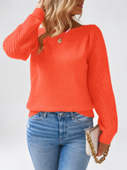 Women's round neck knitted jumper in Orange, close view with open knit sleeves