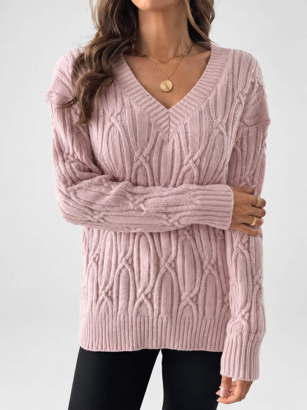 Women's V Neck Knit Jumper with Raised Cable Pattern and Drop Shoulders in Pink – Studio View 3