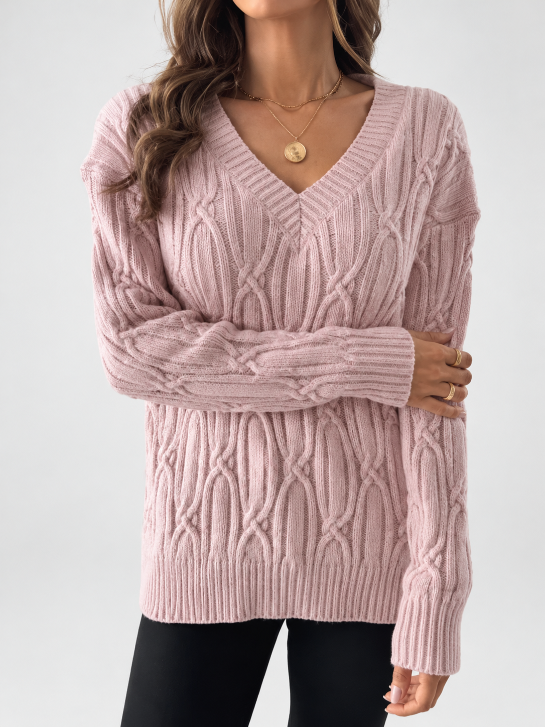Women's V Neck Knit Jumper with Raised Cable Pattern and Drop Shoulders in Pink – Studio View 3