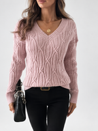 Women's V Neck Knit Jumper with Raised Cable Pattern and Drop Shoulders in Pink – Studio View 5