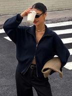 Women's Zip Up Knit Cardigan with Wide Collar and Ribbed Cuffs in Navy – Three-Quarter View